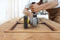 Carpenter work the wood with the sander grinding electric tools Royalty Free Stock Photo