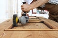 Carpenter work the wood with the sander grinding electric tools Royalty Free Stock Photo