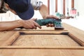 Carpenter work the wood with the sander Royalty Free Stock Photo