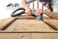 Carpenter work the wood with the sander Royalty Free Stock Photo