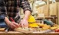 Carpenter at work on wooden boards. Carpentry Royalty Free Stock Photo