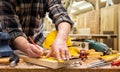 Carpenter at work on wooden boards. Carpentry Royalty Free Stock Photo