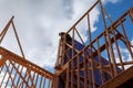 Wood Building frame carpenter at work with wooden roof construction