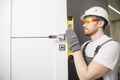 Carpenter worker installation process of wood door hinge tool level Royalty Free Stock Photo