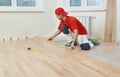 Carpenter worker joining parket floor