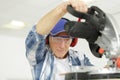 carpenter working on electric buzz saw cutting boards Royalty Free Stock Photo