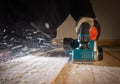 Carpenter working with electric planer Royalty Free Stock Photo