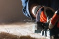 Carpenter working with electric planer Royalty Free Stock Photo