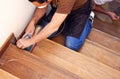 Carpenter working with electric sander