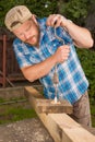 Carpenter working by hand drill Royalty Free Stock Photo