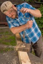 Carpenter working by hand drill Royalty Free Stock Photo