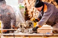 Carpenter working. Man cutting plank by circular saw. Royalty Free Stock Photo