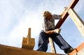 Carpenter working with nails and a box of tools