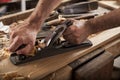 Carpenter working with plane Royalty Free Stock Photo