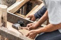 Carpenter working at site construction. Measuring Tape on wood board Royalty Free Stock Photo