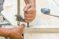 Carpenter working with squeezer tool on the wooden table Royalty Free Stock Photo