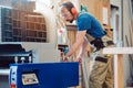 Carpenter working at the circular cutter Royalty Free Stock Photo