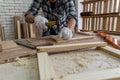 Carpenter working on wood craft at workshop Royalty Free Stock Photo