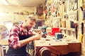 Carpenter working with wood plank at workshop Royalty Free Stock Photo