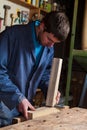 Carpenter working on a Wooden planks with a Vise