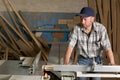 Carpenter working on woodworking machines Royalty Free Stock Photo