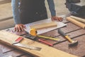 Carpenter working on woodworking machines in carpentry shop. woman works in a carpentry shop. Royalty Free Stock Photo