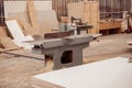 Wood surface planer machine in carpentry workshop