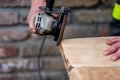 A carpenter works in a garden Royalty Free Stock Photo