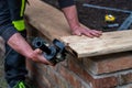 A carpenter works in a garden Royalty Free Stock Photo