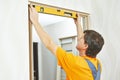 Carpenter works with level Royalty Free Stock Photo