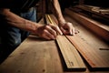 Carpenter works with wooden planks