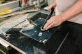 Carpenter works on woodworking equipment. Manufacturing of wood furniture. Workshop for the production of wooden Royalty Free Stock Photo