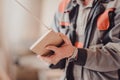 A carpenter works on woodworking the machine tool. Carpenter working on woodworking machines in carpentry shop. Royalty Free Stock Photo