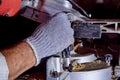 Carpenter works on woodworking machines in the carpentry workshop.