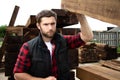Lumber yard worker, carpenter, choosing, seclecting carrying timber planks