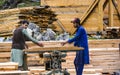 Carpenters cutting wood with professional chop saw Royalty Free Stock Photo