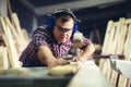 Carpenters cutting wooden plank with a circular saw Royalty Free Stock Photo