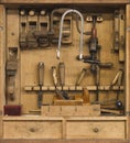 Carpenters tools in a wooden cabinet