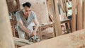 Carpenters work using electric wood dowels