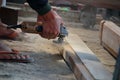 Carpenters work on woodworking machinery in carpentry shops