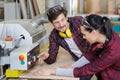 carpenters working on lumbermill factory machine