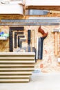 Carpenters workshop interior with wooden planks and work tools of the trade Royalty Free Stock Photo