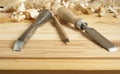 Carpentry concept.Joiner carpenter workplace. Construction tools on wooden table with shavings. Copy space for text. Royalty Free Stock Photo