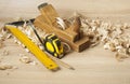 Carpentry concept.Joiner carpenter workplace. Construction tools on wooden table with shavings. Copy space for text. Royalty Free Stock Photo