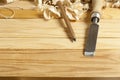 Carpentry concept.Joiner carpenter workplace. Construction tools on wooden table with shavings. Copy space for text. Royalty Free Stock Photo