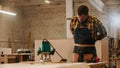Carpentry industry - man worker puts on his apron