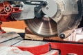 Carpentry machine circular saw cuts a board in carpentry workshop Royalty Free Stock Photo