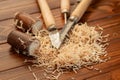 Carpentry tool set with wood shavings on wooden table Royalty Free Stock Photo