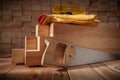 Carpentry Tools Handsaw With Wooden Handle Yellow Safety Goggles Leather Gloves On Satck Of Wooden Beams