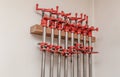Carpentry tools hang on the wall of the production workshop. Wood processing Royalty Free Stock Photo